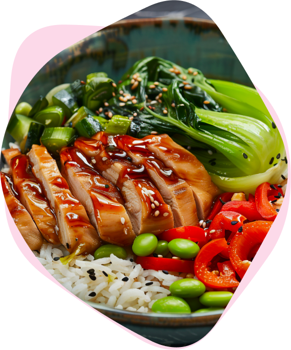 Sliced glazed chicken with rice, bok choy, edamame and red capsicum